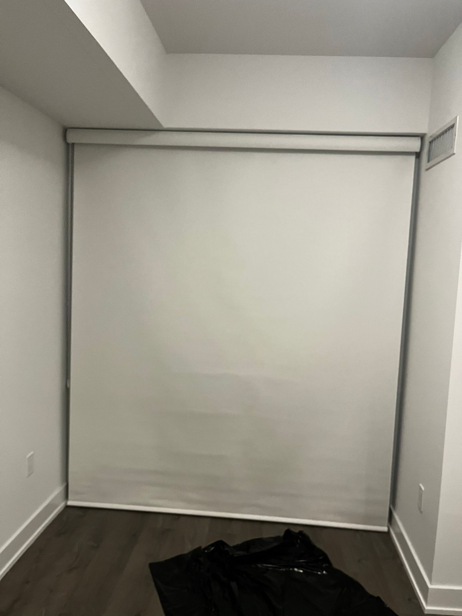 Opaque roller shade creating private room-darkening coverage